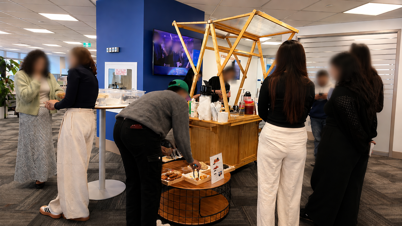 Guests gathered around the matcha cart at an office event