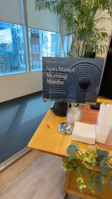 The Spin Master Morning Matcha sign and drinks station at the office event